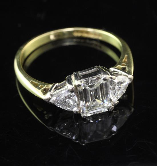 A modern 18ct gold and diamond three stone ring, size N.